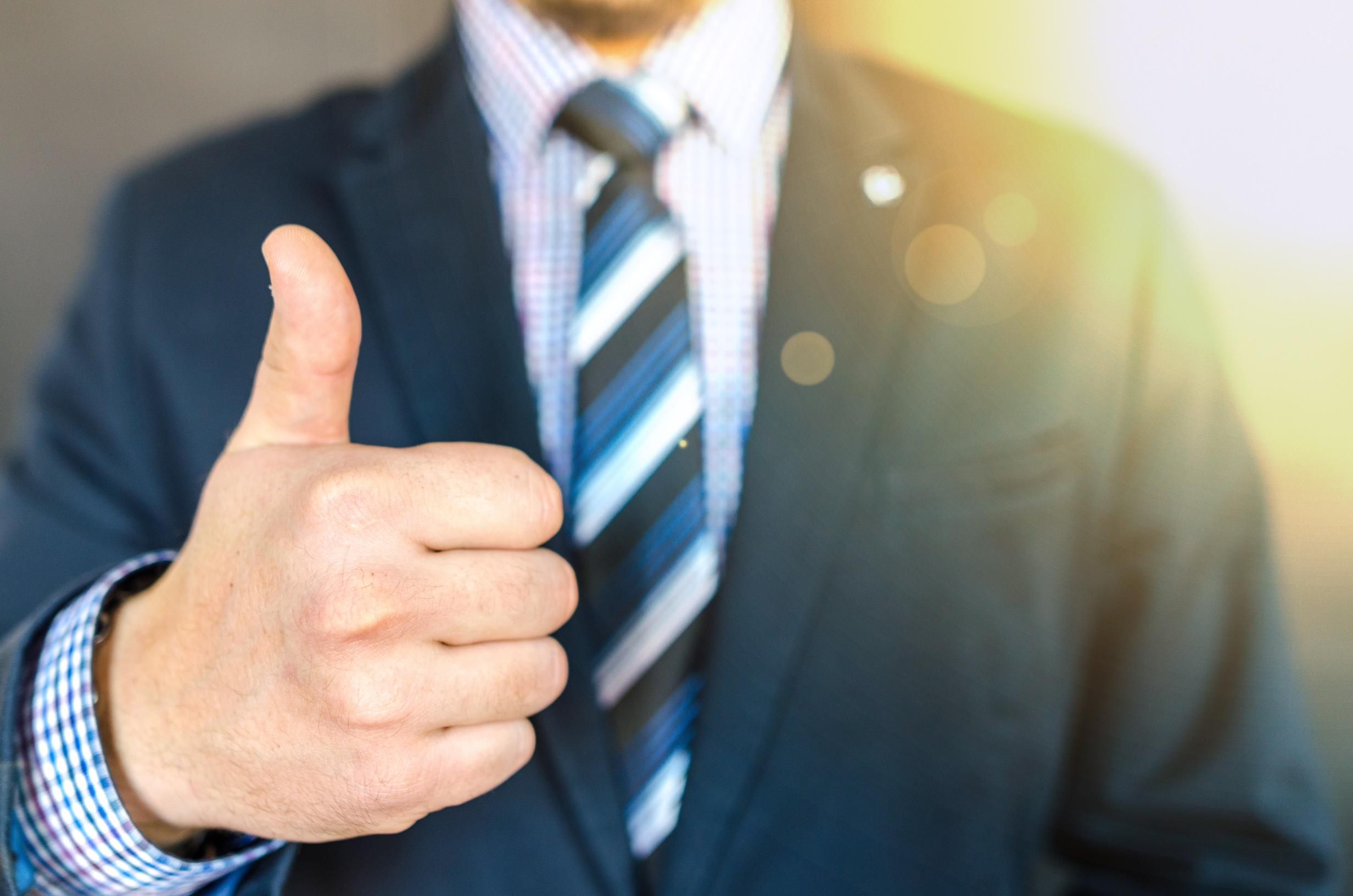 close-up-photo-of-man-wearing-black-suit-jacket-doing-thumbs-684385.jpg